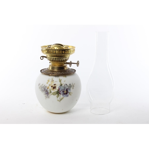 137 - A vintage milk glass oil lamp with hand-painted details.