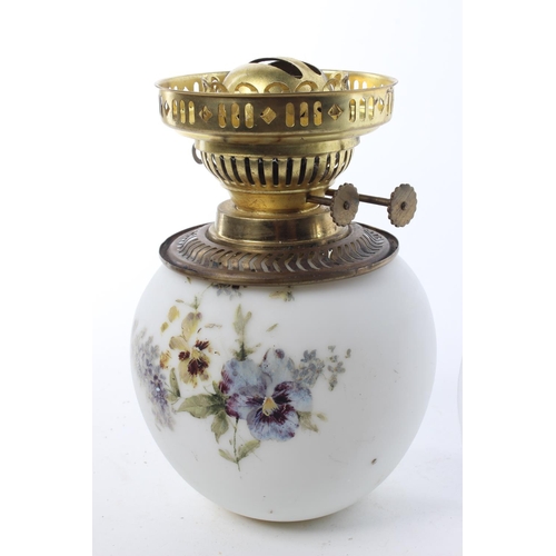 137 - A vintage milk glass oil lamp with hand-painted details.