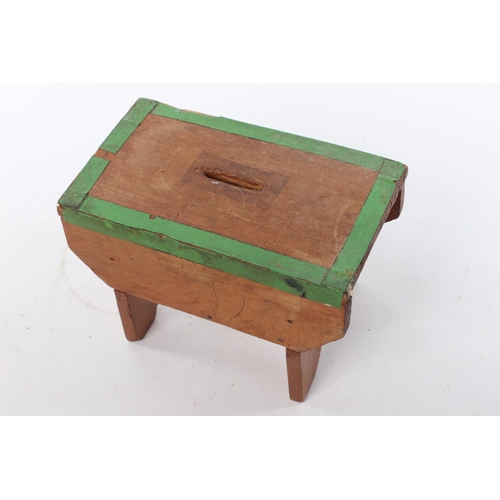 146 - An antique handmade vernacular money box, in the form of a stool.