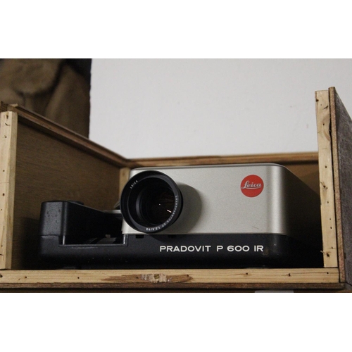 153 - A vintage Leica Pradovit P 600 IR projector with original paper work and carry case.