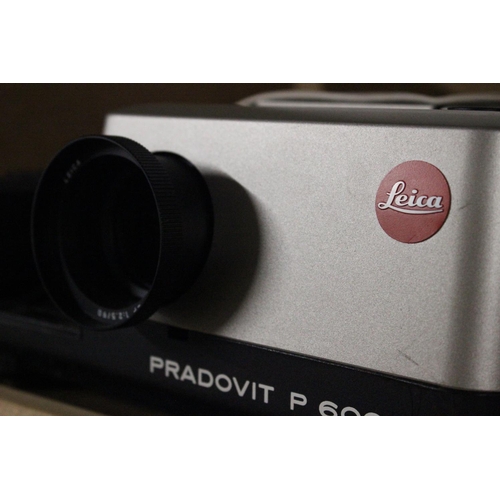 153 - A vintage Leica Pradovit P 600 IR projector with original paper work and carry case.