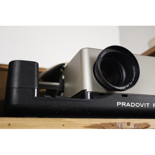 153 - A vintage Leica Pradovit P 600 IR projector with original paper work and carry case.