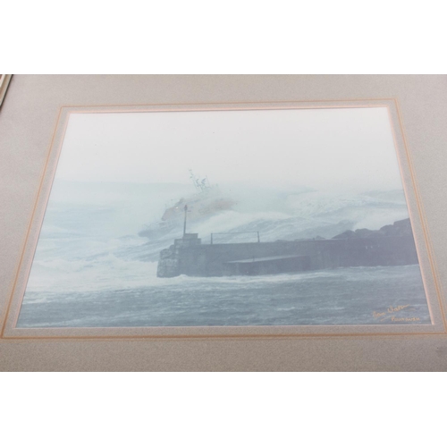 155 - A framed print of the Portrush lifeboat, signed by the photographer Ian Watson. Approx  29x24cm.