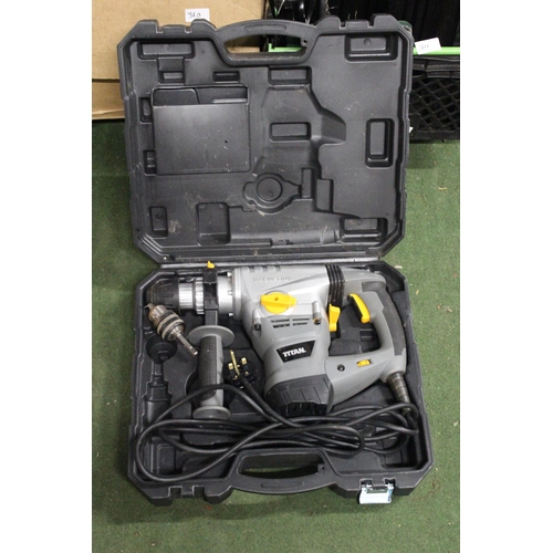 160 - A Titan nail gun with carry case.