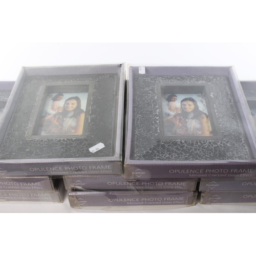 173 - A collection of modern glass photo frames.