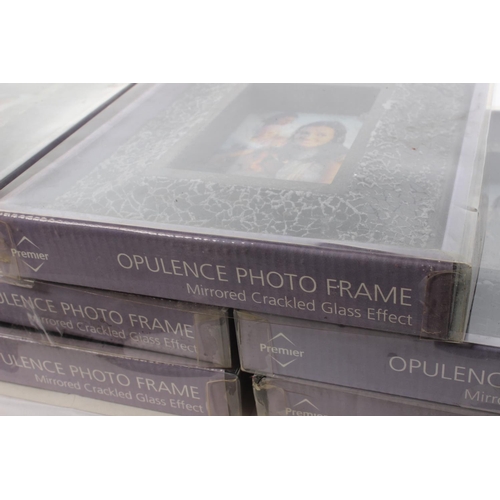 173 - A collection of modern glass photo frames.