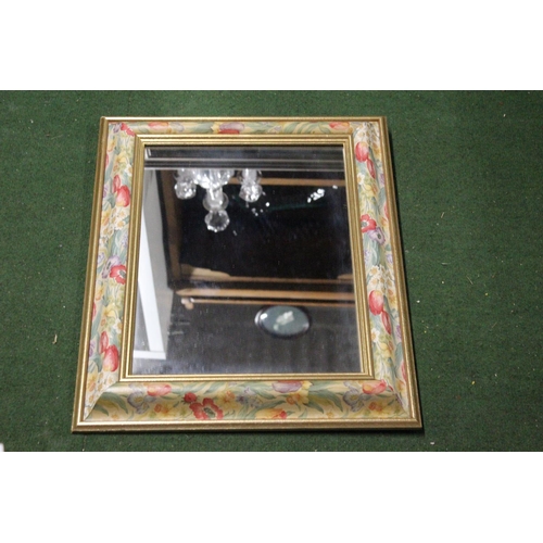 191 - A decorative wood framed mirror.