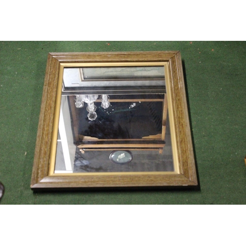 193 - A modern wood framed mirror.