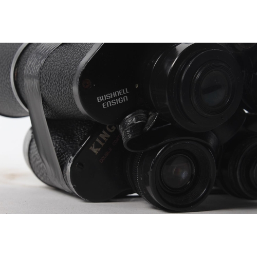 125 - A pair of Bushnell ensign binoculars and a pair of King binoculars (A/F).