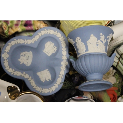 206 - An assortment of items to include ceramics, glassware and more.