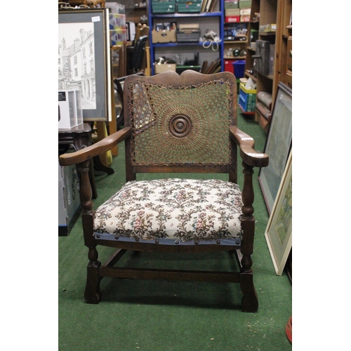 216 - A vintage chair with decorative woven back.