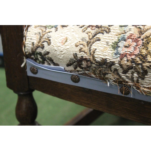 216 - A vintage chair with decorative woven back.