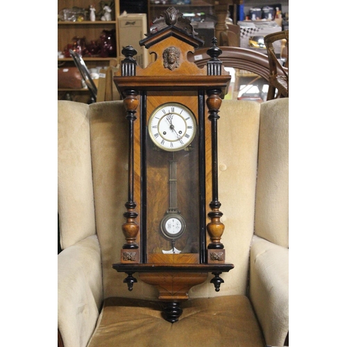 221 - An antique Vienna wall clock. Approx  95cm.