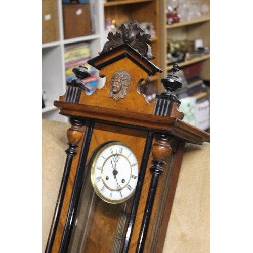 221 - An antique Vienna wall clock. Approx  95cm.