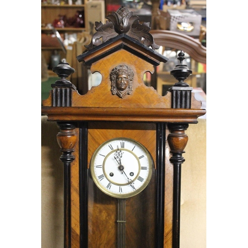 221 - An antique Vienna wall clock. Approx  95cm.