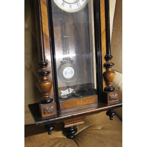 221 - An antique Vienna wall clock. Approx  95cm.