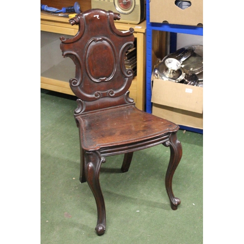 226 - A stunning antique shield back hall chair.