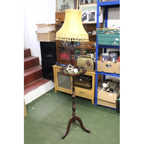 227 - A wine table with green leather top and table lamp.