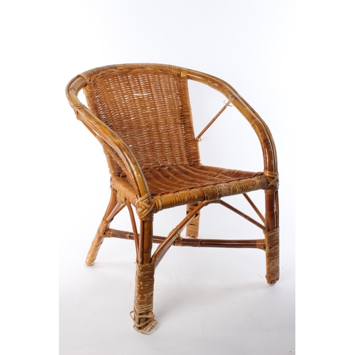 229 - A retro wicker and cane children's chair.