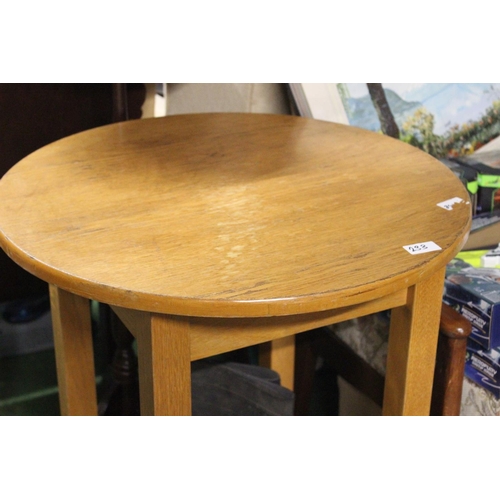 233 - A circular pine table.