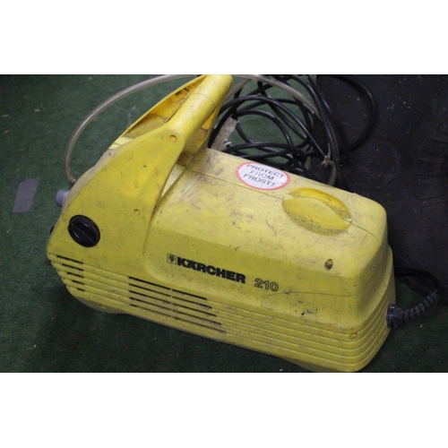 234 - A power washer and a pair of wellington boots.