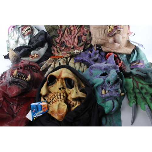 235 - An assortment of Halloween masks and accessories.