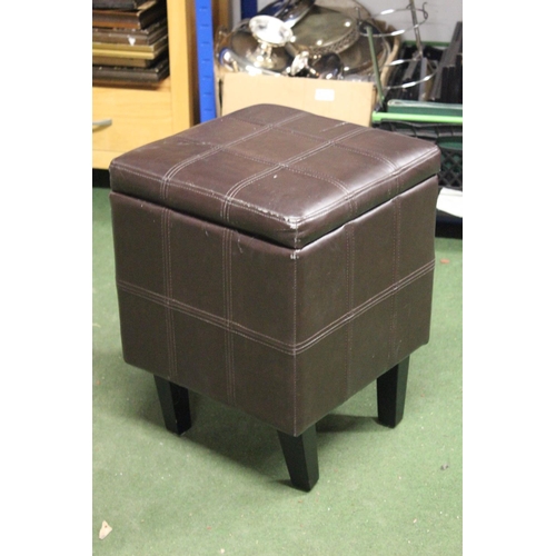 242 - A leather footstool / ottoman.