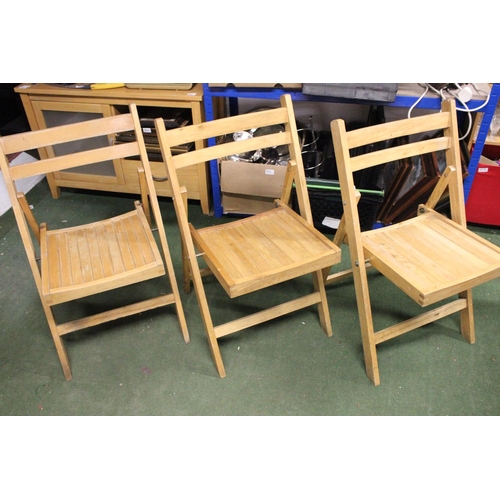 243 - Three folding chairs.