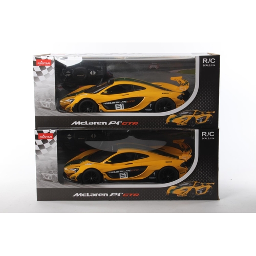 249 - 2 boxed remote control McLaren P1 GTR cars.