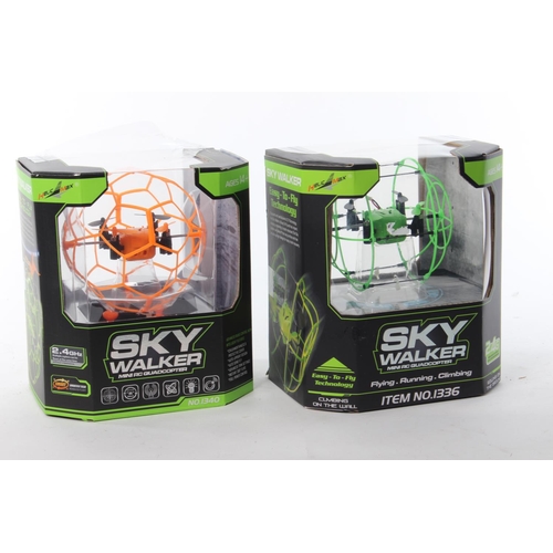 275 - 2 boxed remote control Sky Walkers.