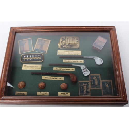 282 - A framed golfing display.