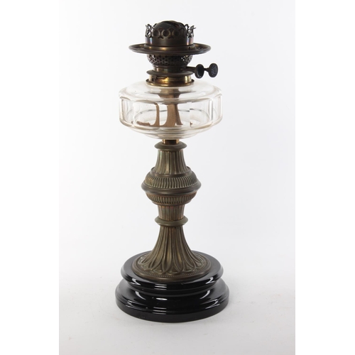 339 - An antique oil lamp with clear glass bowl.