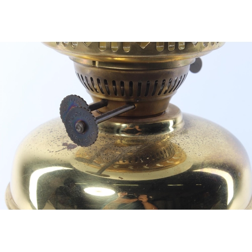 340 - An antique oil lamp with brass base & decorative etched glass shade.