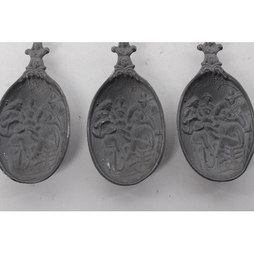 390 - 3 decorative antique pewter spoons.