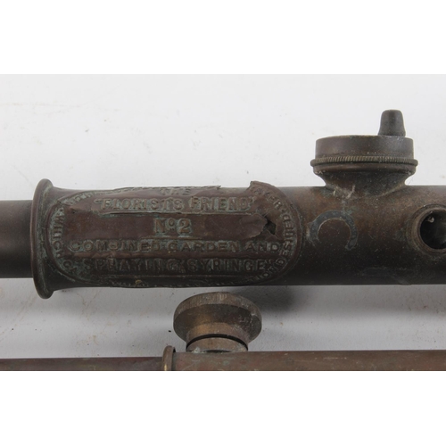 396 - 2 antique copper spray pumps.