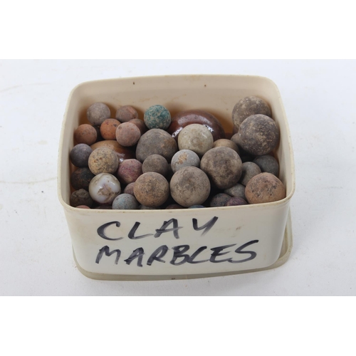 403 - A collection of antique clay marbles.