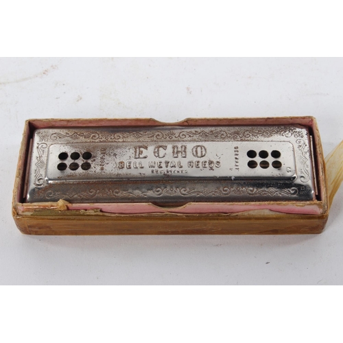 405 - A vintage Hohner Echo harmonica.