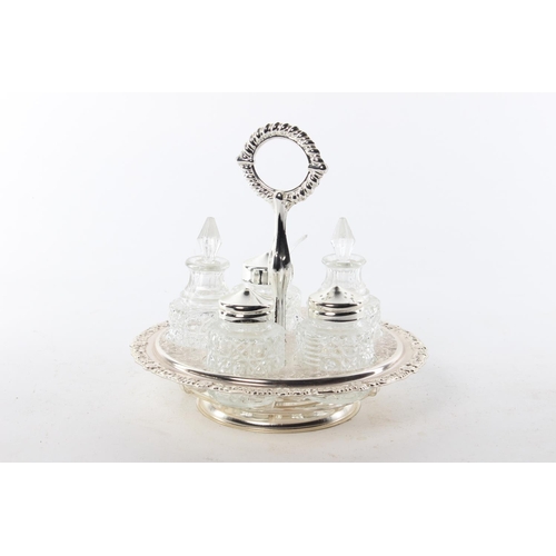 406 - A decorative antique style condiment set in silver plated holder.