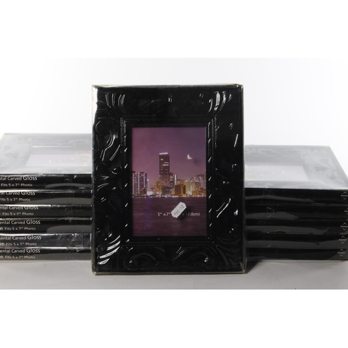 409 - A set of 12 boxed photo frames.