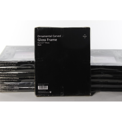 409 - A set of 12 boxed photo frames.