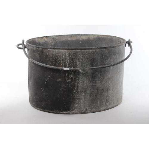 431 - A vintage black metal pot.