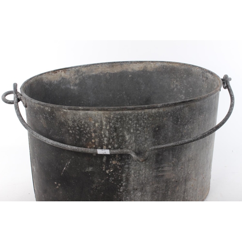 431 - A vintage black metal pot.