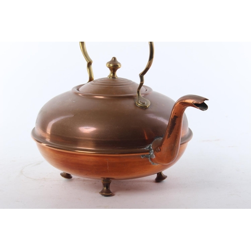 438 - A vintage copper kettle.