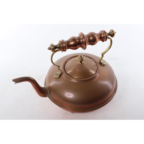 438 - A vintage copper kettle.