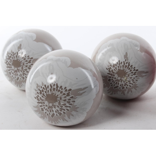 442 - A set of 3 decorative glass balls & candle.