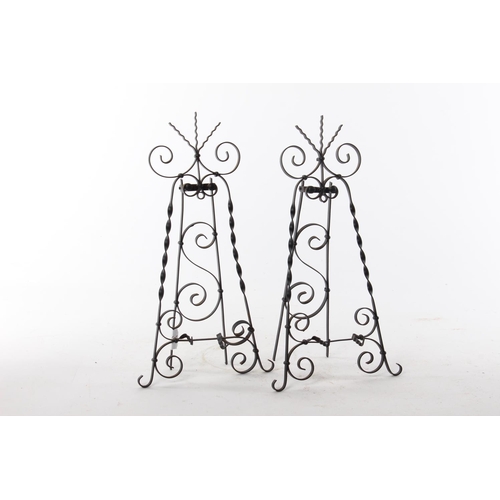 449 - A pair of handmade wrought metal table top easels.