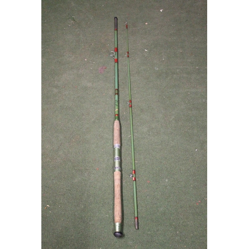 452 - A cased Milbro 2 piece fishing rod.