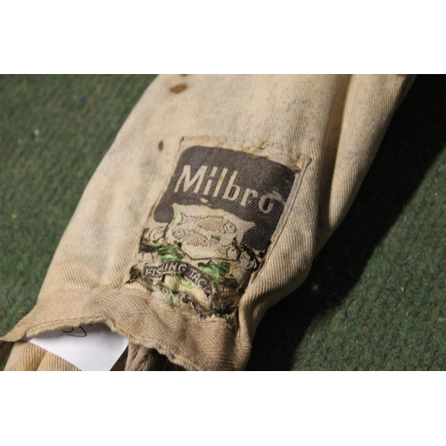 452 - A cased Milbro 2 piece fishing rod.