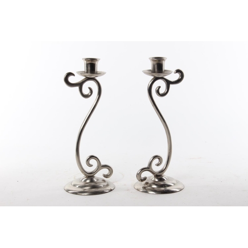 461 - A pair of decorative candlesticks.