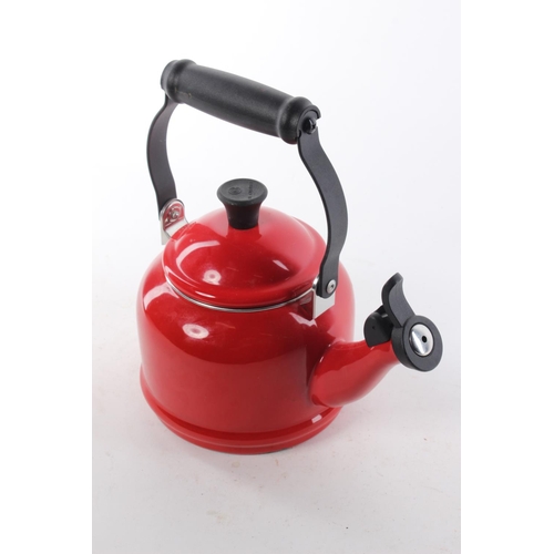 463 - A L Creuset red kettle.